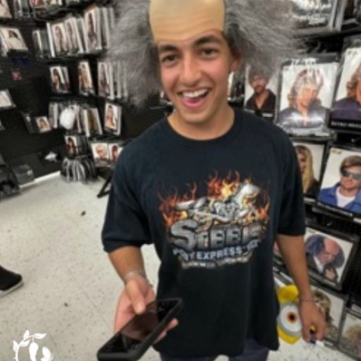 Halloween Costume Shop Shenanigans — Trying on the Mad Scientist Wig